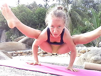 Sexy gymnast performs public hot yoga exercises
