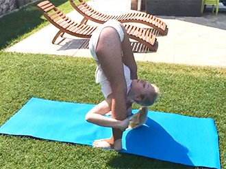 Super flexible girl does outdoor sexy yoga exercises