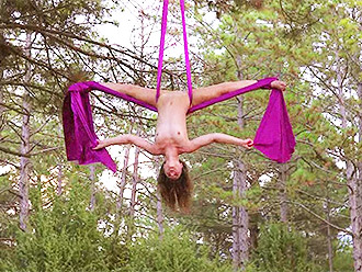 Nude contortionist displays naked yoga and hot gymnastics outdoor